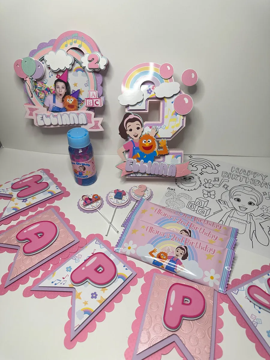 Ms. Rachel party table with a 3D number, banner and treats